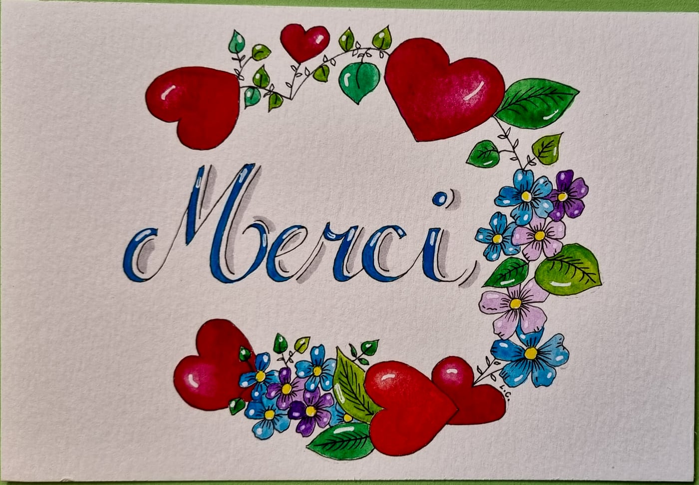 Carte Merci, cœurs et fleurs, aquarelle et calligraphie sur papier, par Laure C.