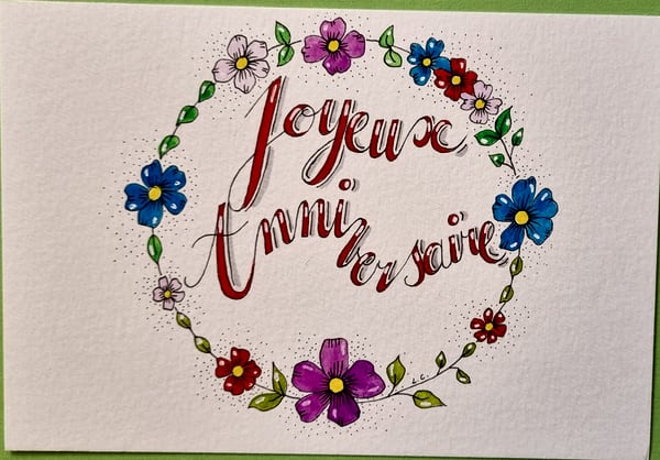 Carte Joyeux anniversaire, la couronne fleurie, aquarelle et calligraphie sur papier, par Laure C.
